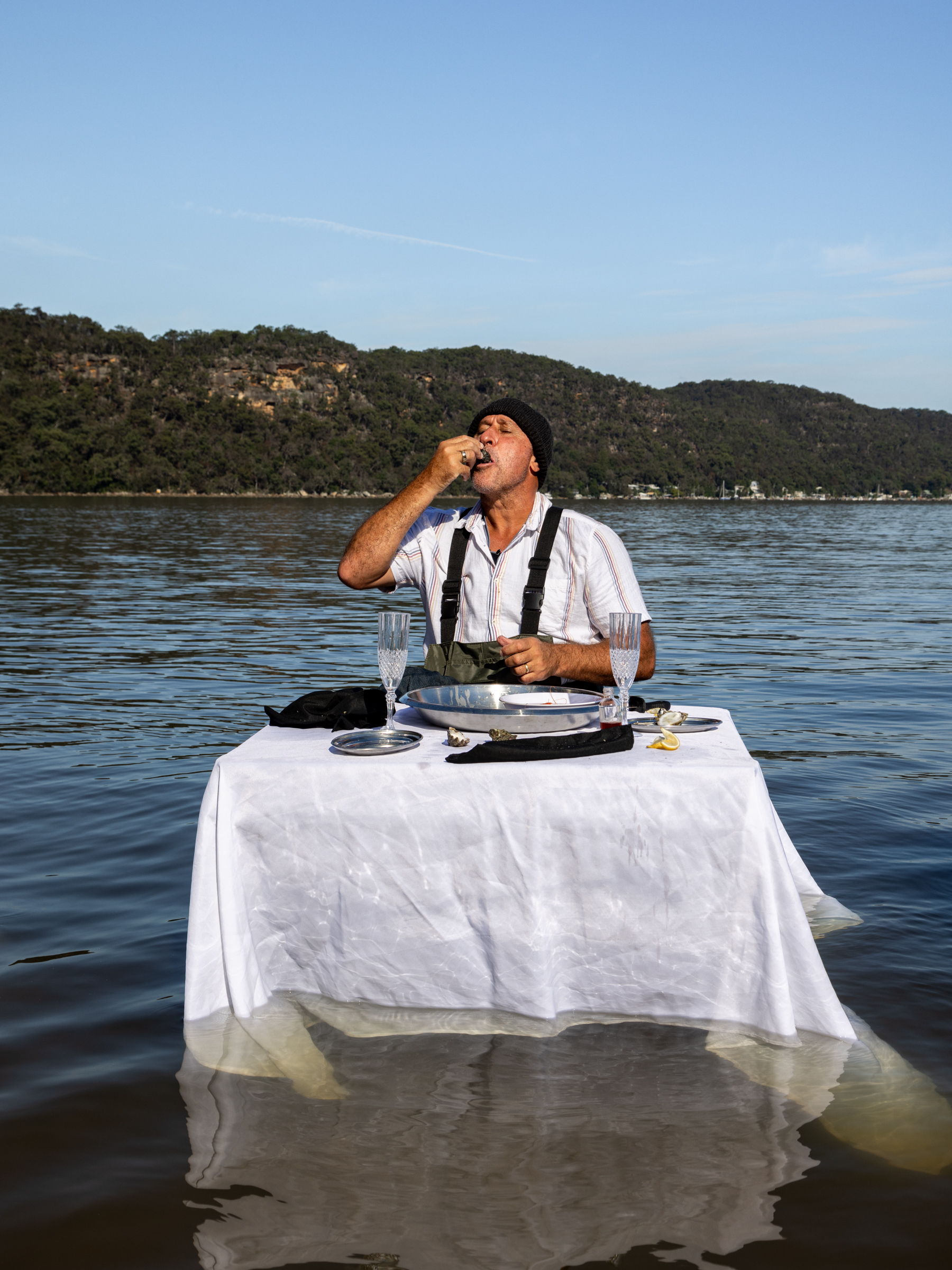 Man eating oysters during a Sydney Oyster Farm Tours Central Coast